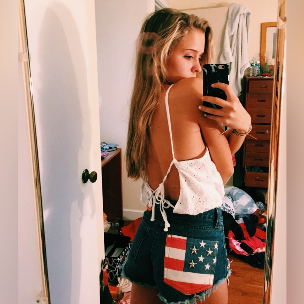 Cut off ripped jeans shorts with American flag pocket